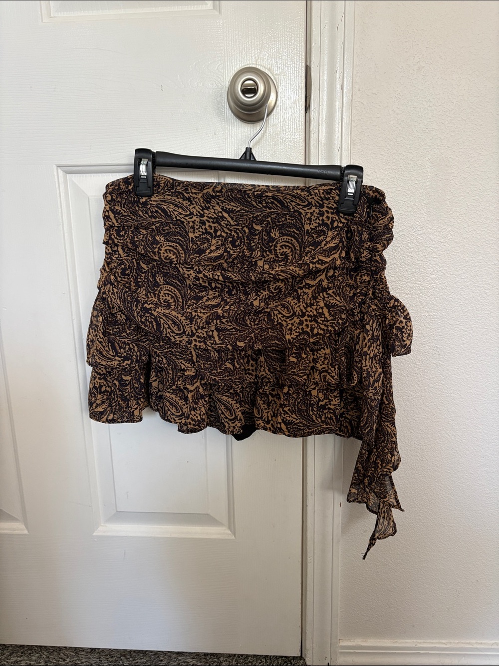 Amber Sky brown and black paisley print ruffle mini skort.